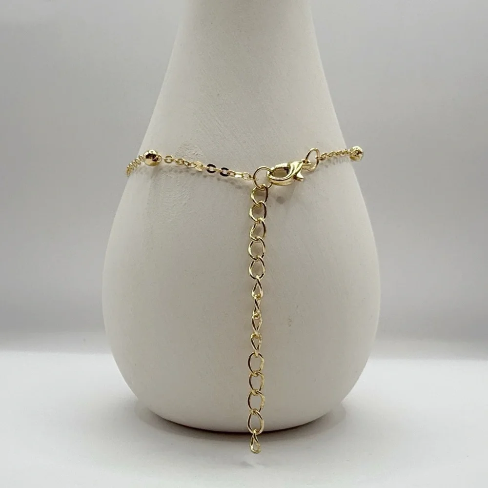 Gold Beaded Bracelet With Whale Tail Charm